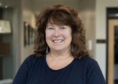 Colleen Sunderlin smiles at the camera.