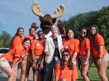 Provost Nesbitt with Trax and Students welcoming first years to campus Fall 2023