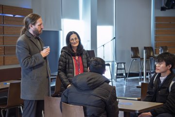 Deans Jason Denman and Sharon Wise chat with studetns in the Pioneer Pub.