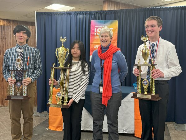 Provost Stephanie Nesbitt stands with winners of the 2024 Regional Science Fair.