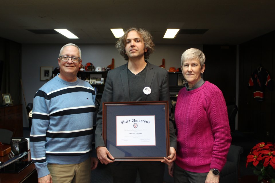 Douglas Edwards, with the 2023 Harold T. Clark Award, stands between President Todd Pfannestiel and Interim Provost Stephanie Nesbitt.